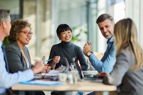 business associates meeting around a conference room table