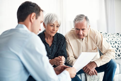 older couple donor planning with a financial advisor