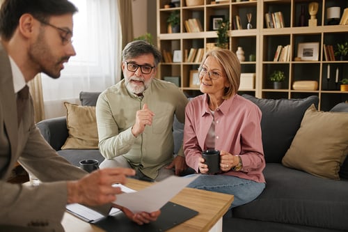 couple speaking with financial advisor about legacy giving