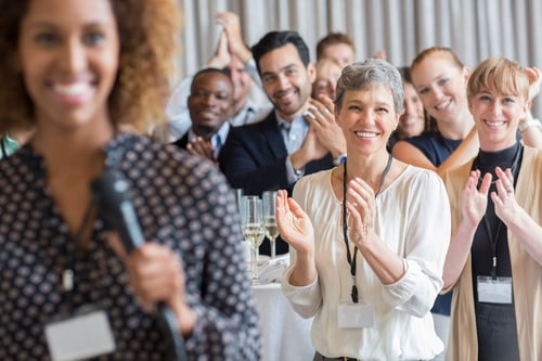 people clapping at donor planned giving event