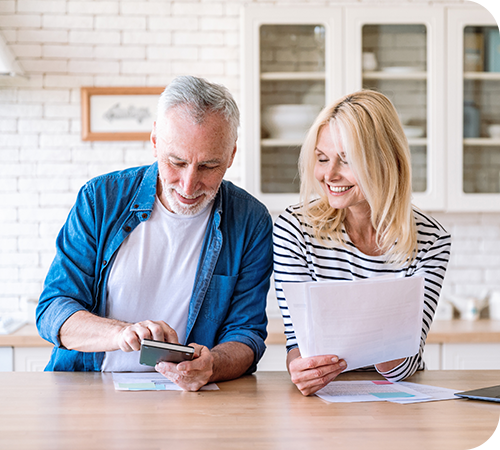 mature-couple-planning-for-retirement-smiling-3